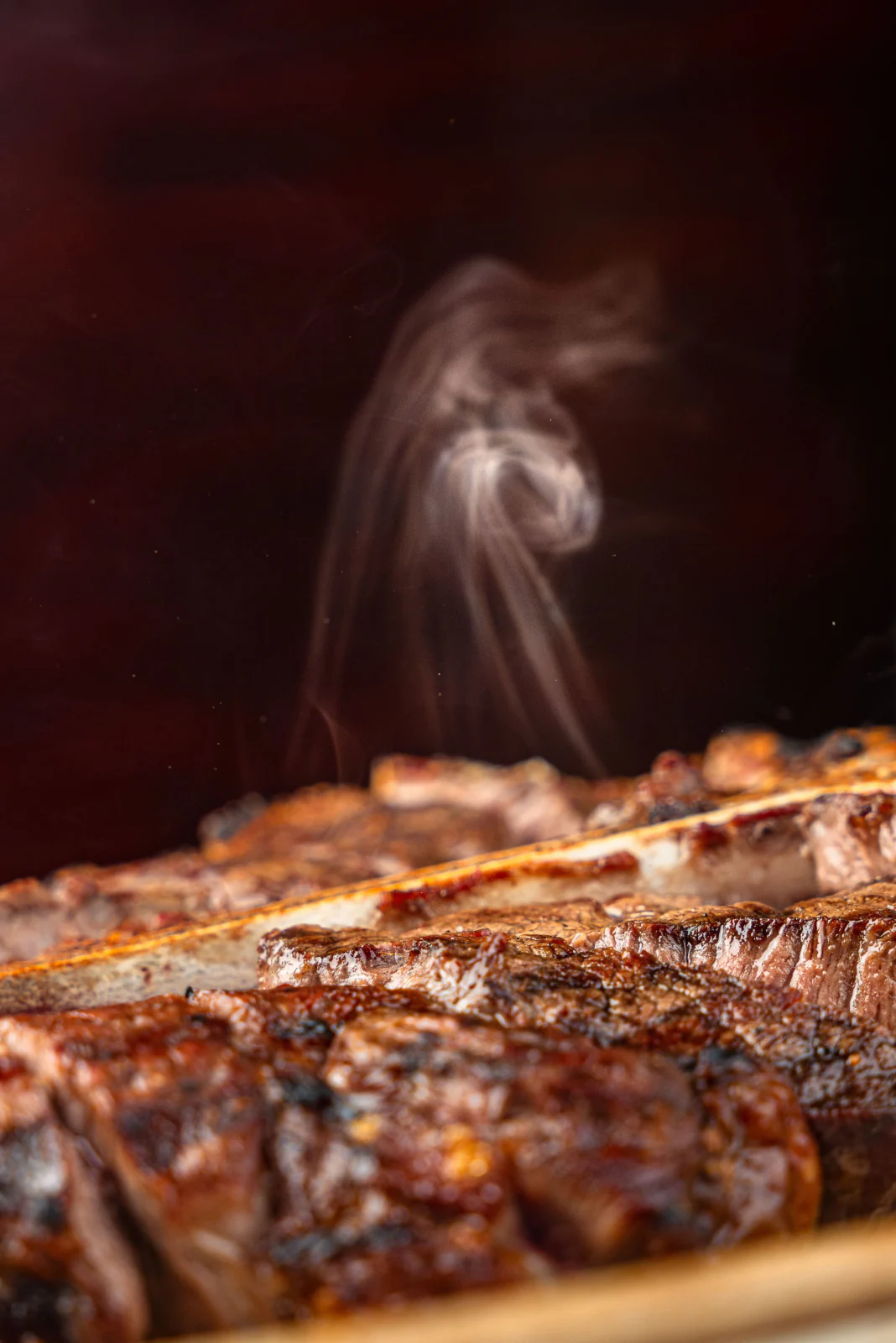 Grilled steak detail with smoke