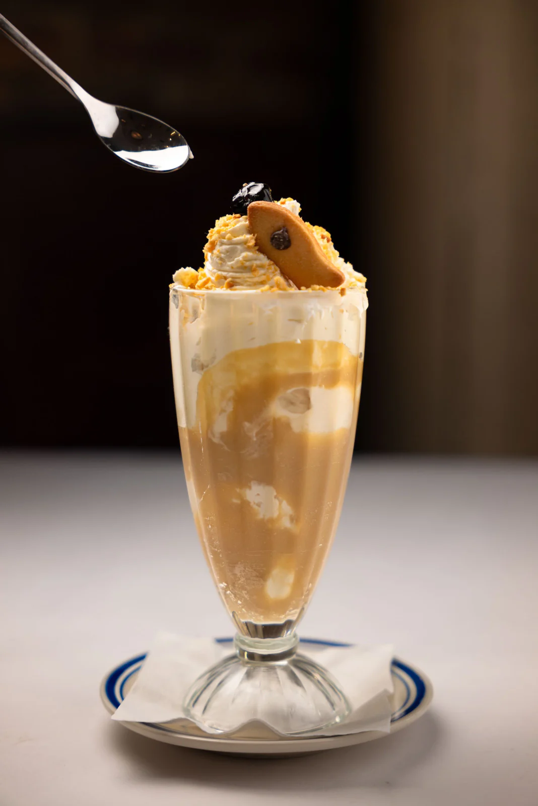 Tall dessert drink with whipped cream
