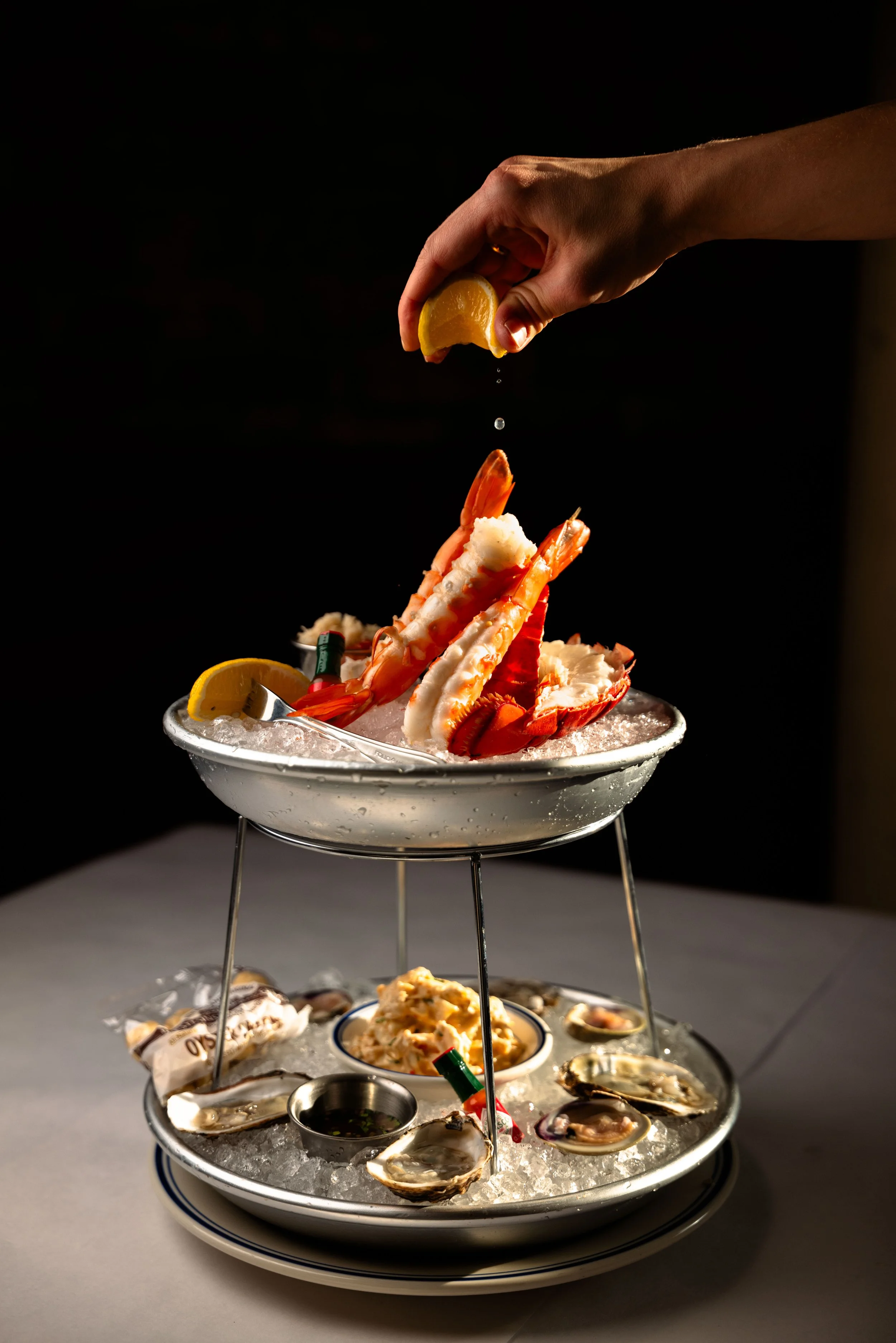 Seafood tower with lemon squeeze
